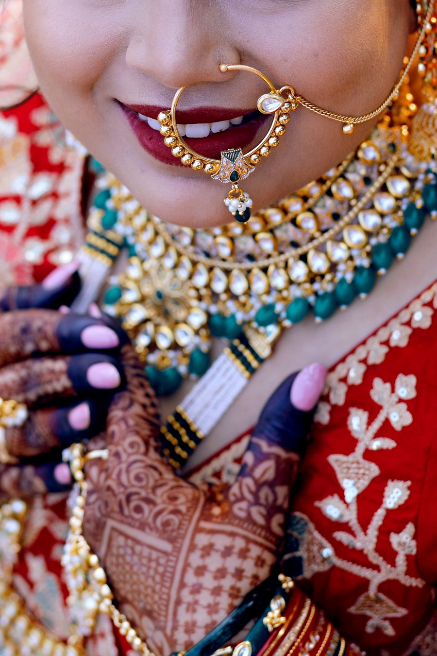 Bride in traditional jewellery with henna