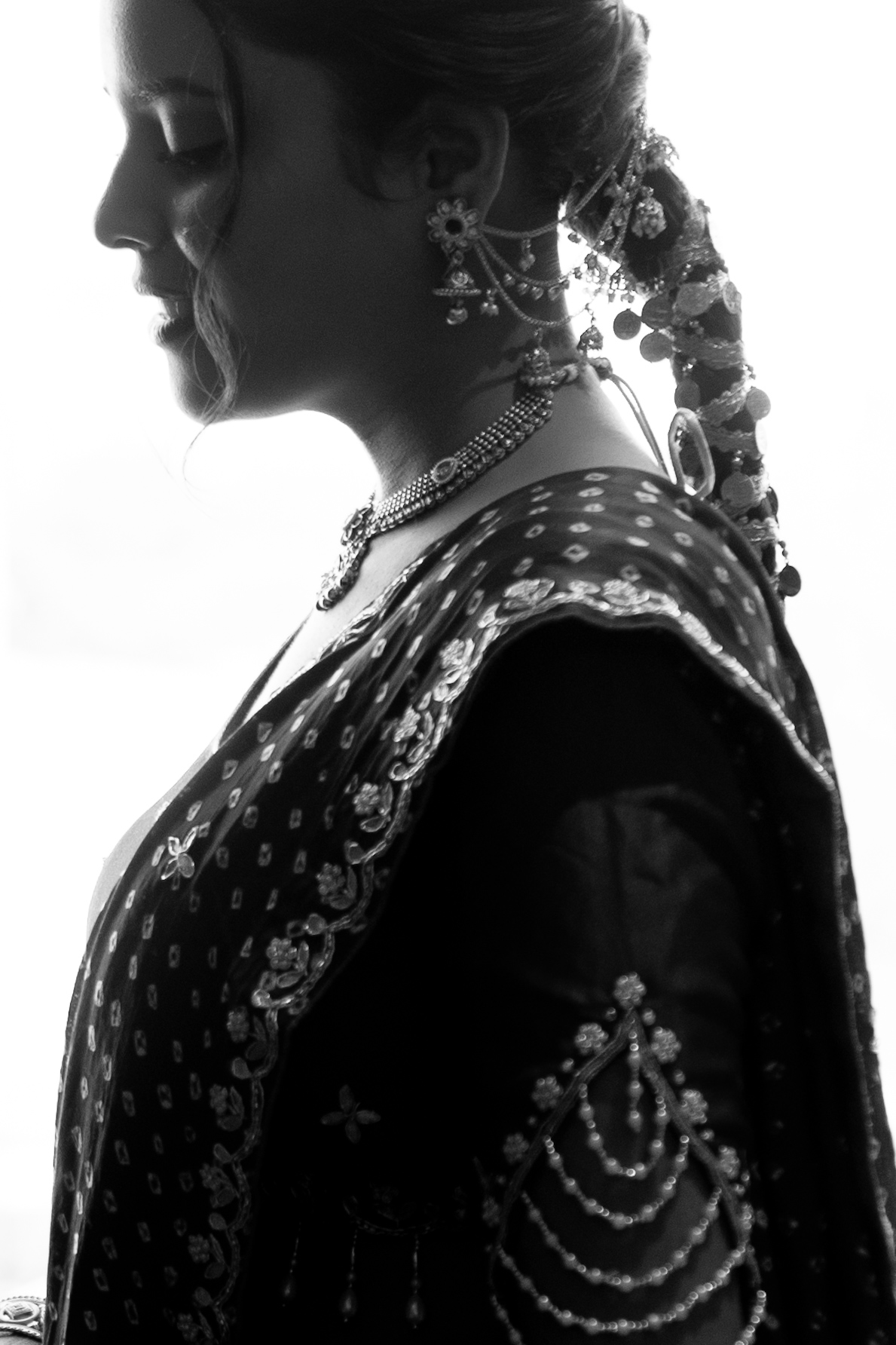 Bride in traditional jewellery with henna